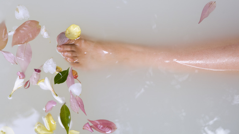 Leg and petals in milk bath