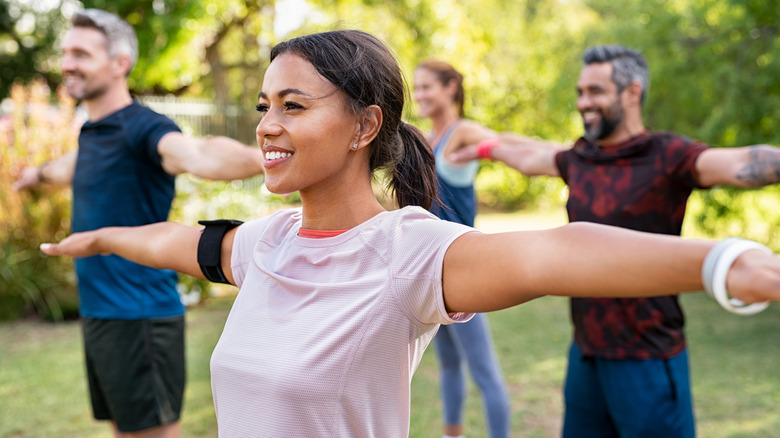 Smiling outdoor exercise class