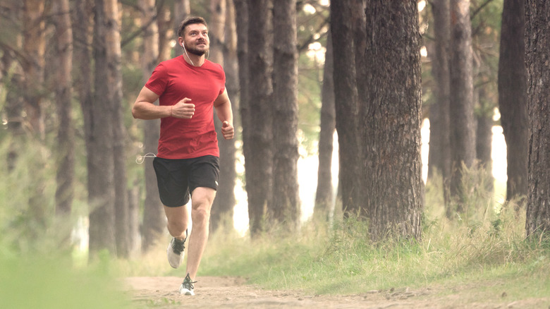 man running along a trail