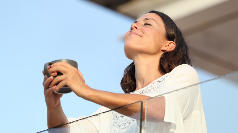 smiling woman with mug