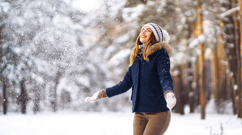 woman smiling in snow