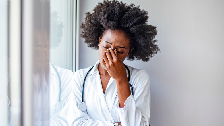 doctor with headache