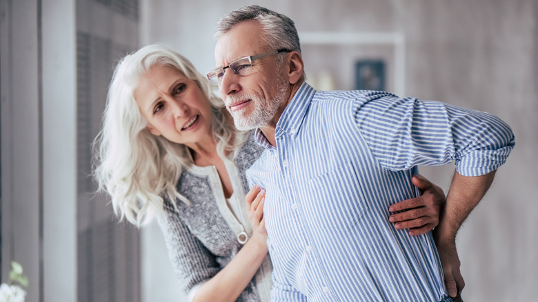 older man with back pain