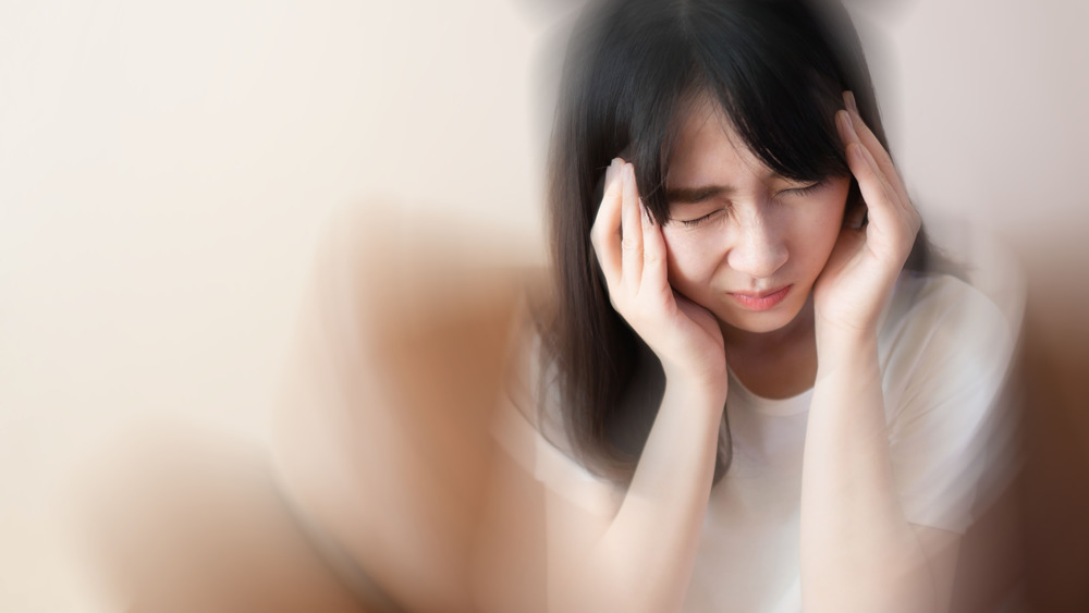 woman with pain in head