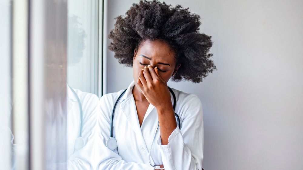 doctor with headache