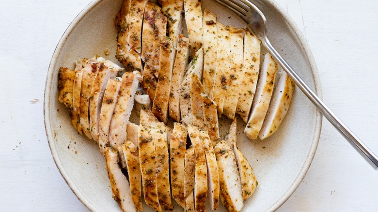 cooked chicken in white bowl