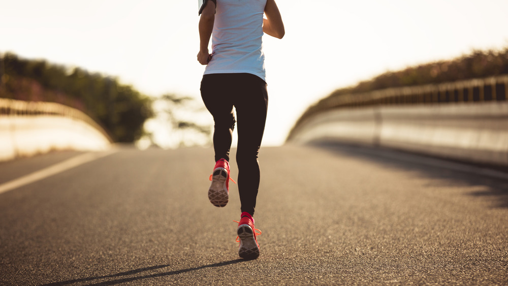 Woman running on road