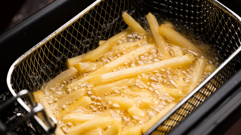 French fries cooking in oil