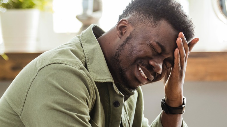 Man with painful headache