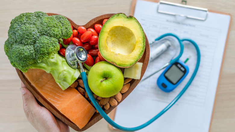 Heart-shaped bowl of healthy foods