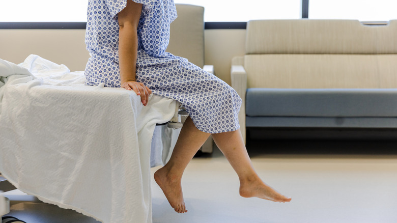Woman hospital bed gown