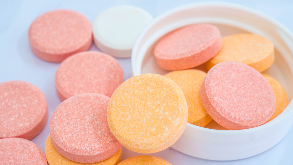 orange, pink, and white antacid tablets
