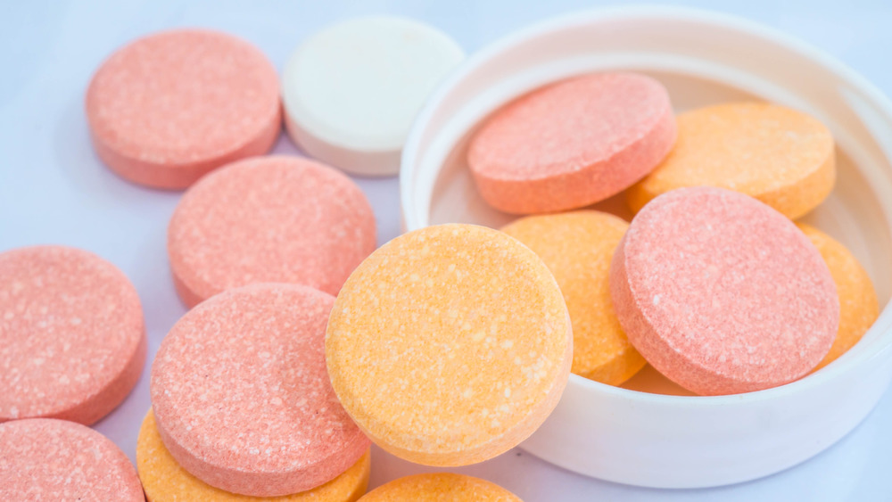 orange, pink, and white antacid tablets