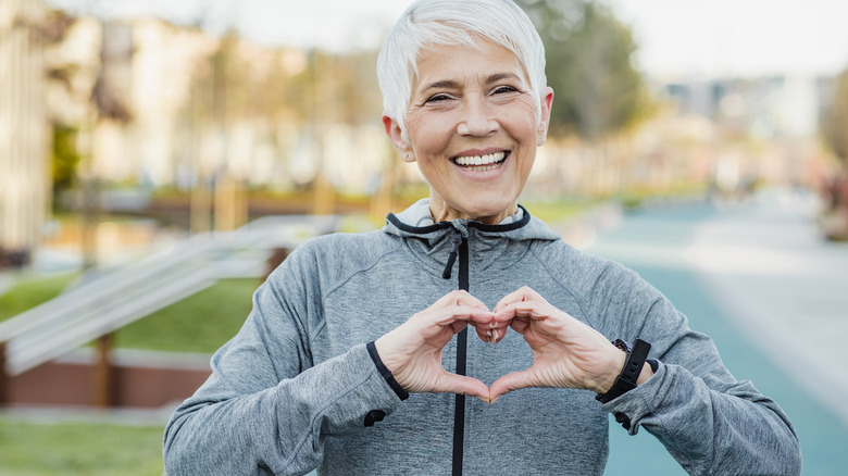 woman making heart with hands