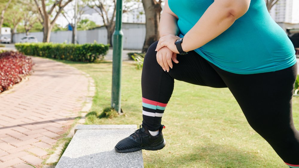 Woman stretching before exercising