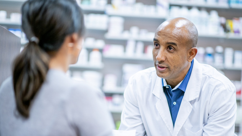 pharmacist talking to customer