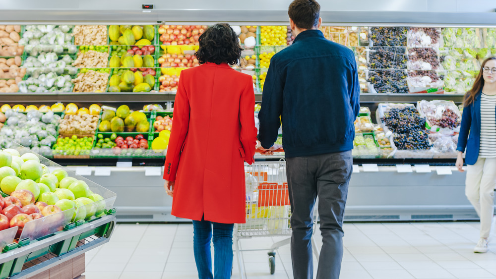 Couple shopping in produce aisle