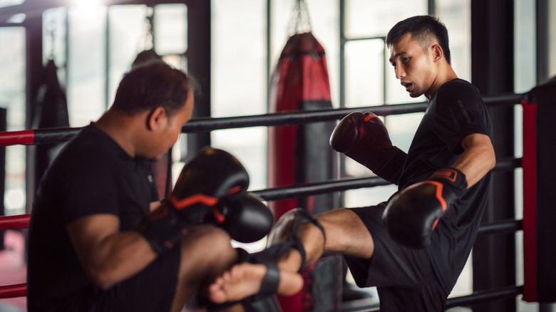 Two men sparring in kickboxing