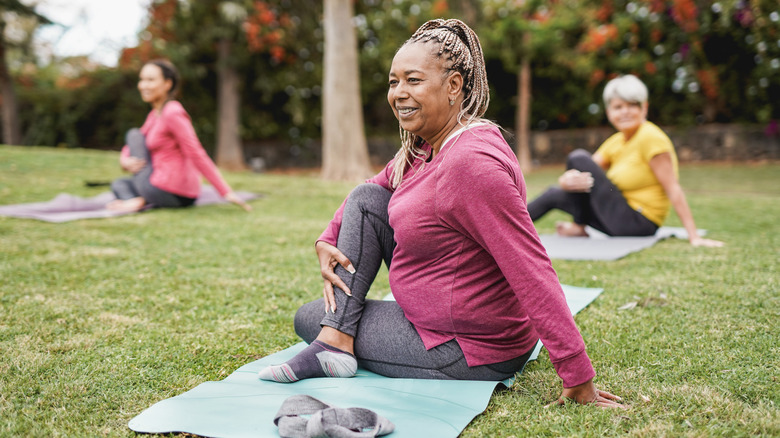 a group of older women practicing yoga 