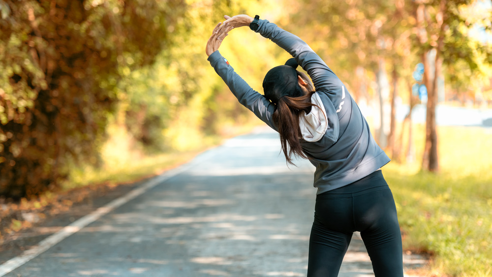 Woman stretching before run