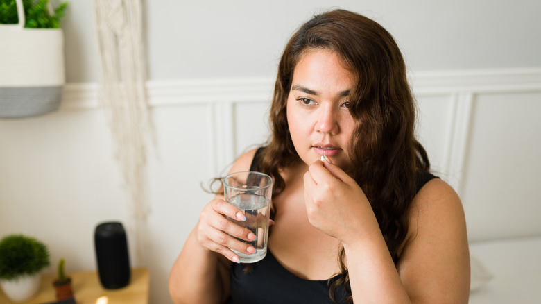 woman taking medication 