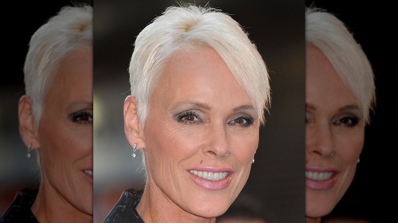 Brigitte Nelsen smiling at a celebrity event while wearing a black dress