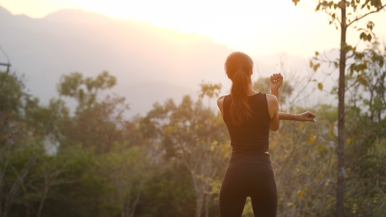 woman stretching outside