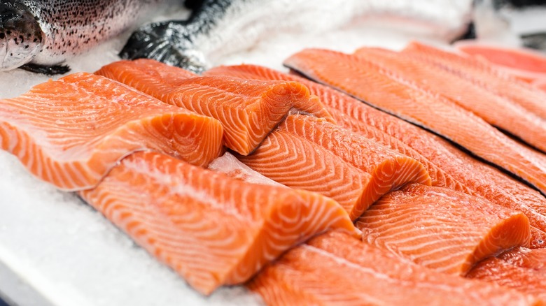 Several pieces of salmon laying out 