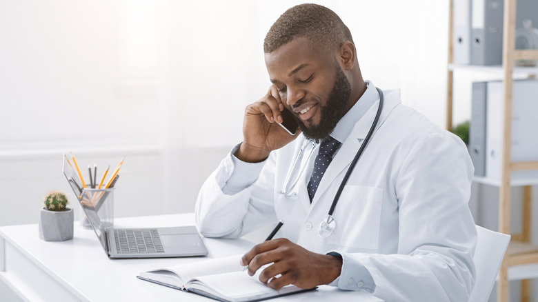 african american male doctor on the phone