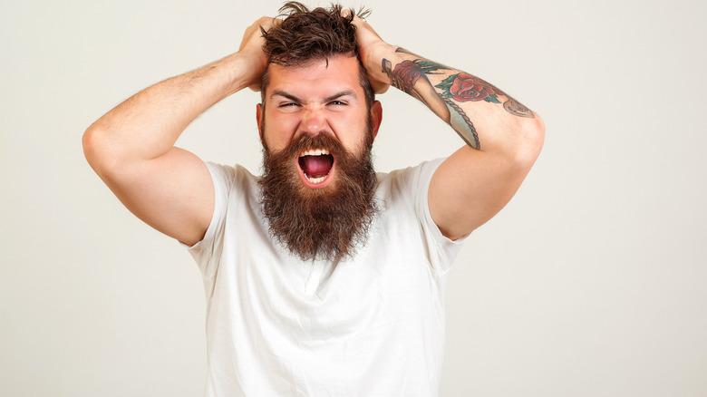 angry man screaming in rage