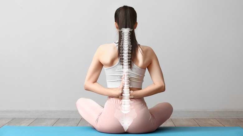 Woman with image of spine on back