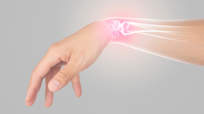 Extended hand with highlighted wrist bones
