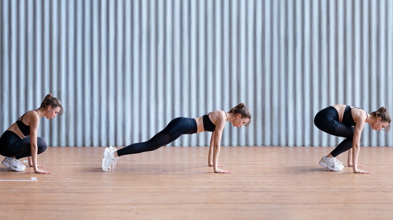 Woman going through burpee succession 