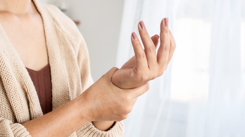 woman looking at hands