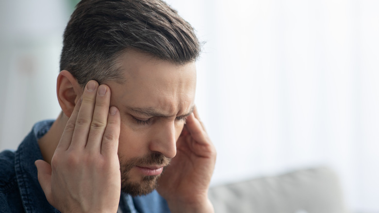 middle-aged man with migraine