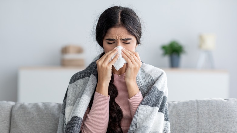 A woman is sick at home