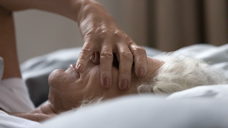 Closeup of woman unable to sleep in bed