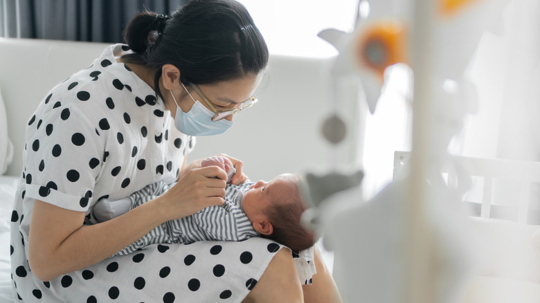 Mother looking at newborn