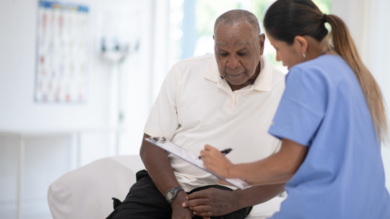 Healthcare provider speaking with patient