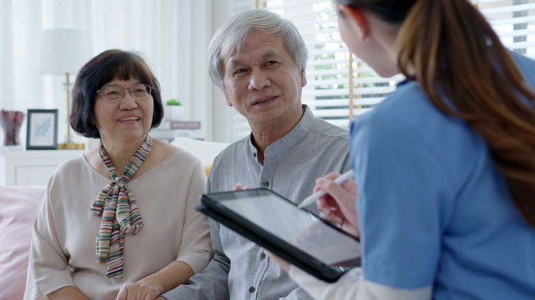 man and woman with doctor