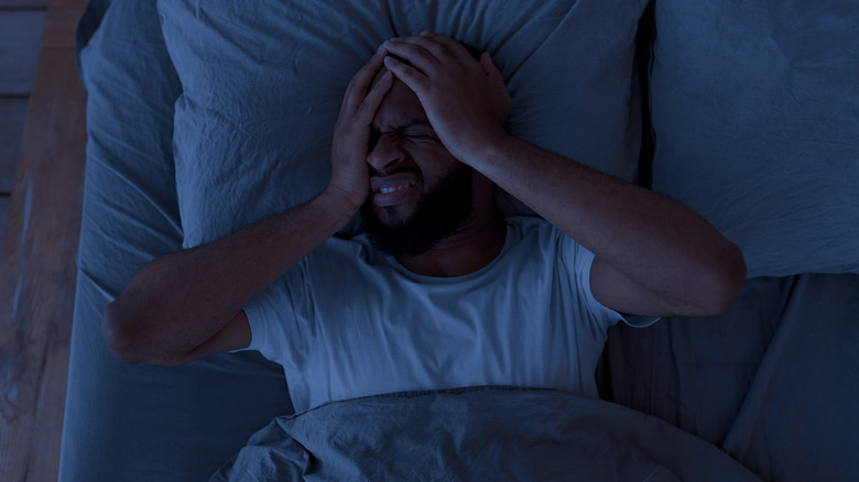 Man lying down in pain