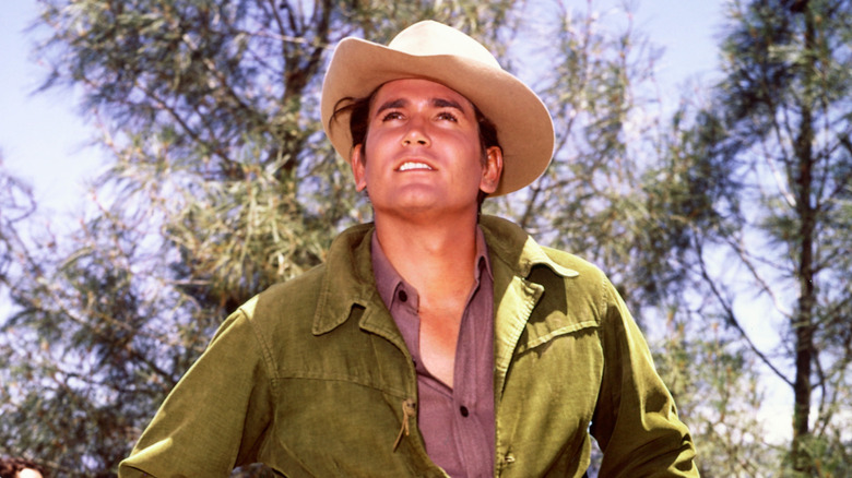 Michael Landon wearing a fedora