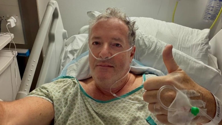 Piers Morgan in a hospital bed after hip surgery