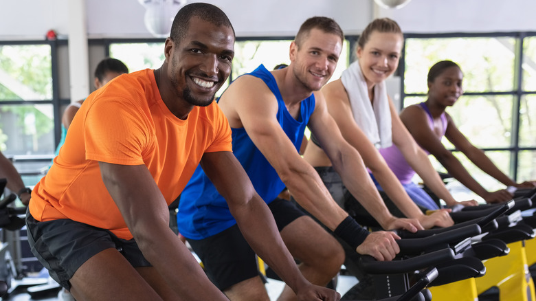 group of diverse people in a spin class