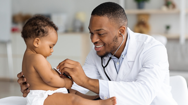 doctor examining baby