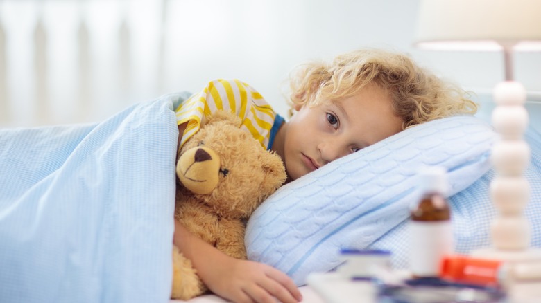 child ill in bed
