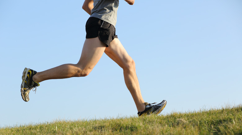 side view of runner's legs