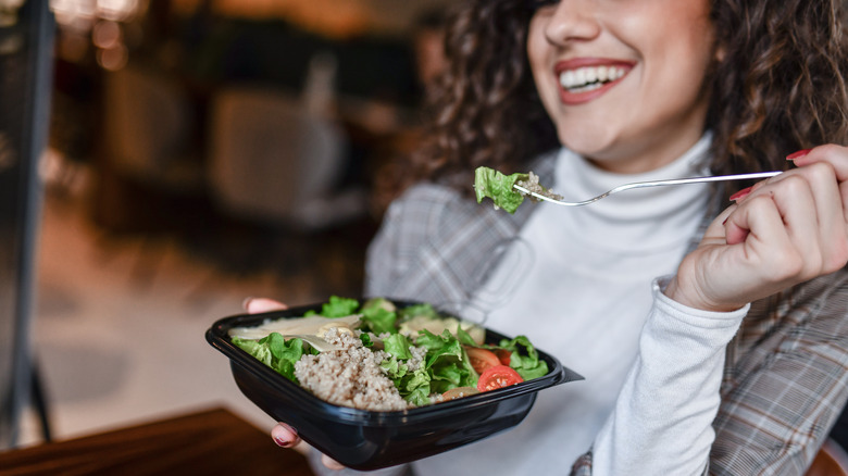 Woman eating tuna salad