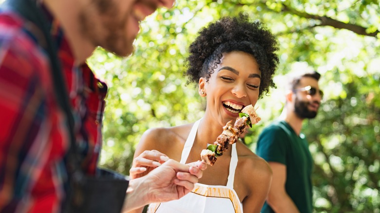 People enjoying summer barbecue event