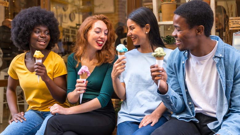 diverse adults eating ice cream